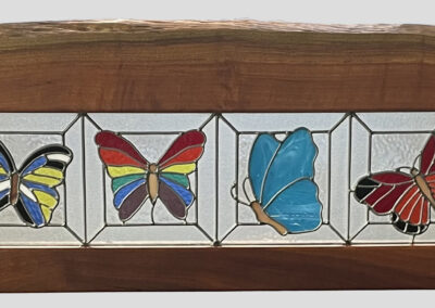 Bench glass butterflies close up