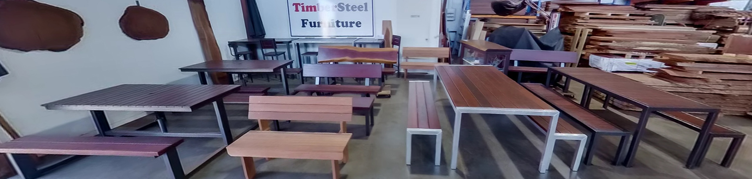 View inside timbersteel furniture workshop with furniture on display